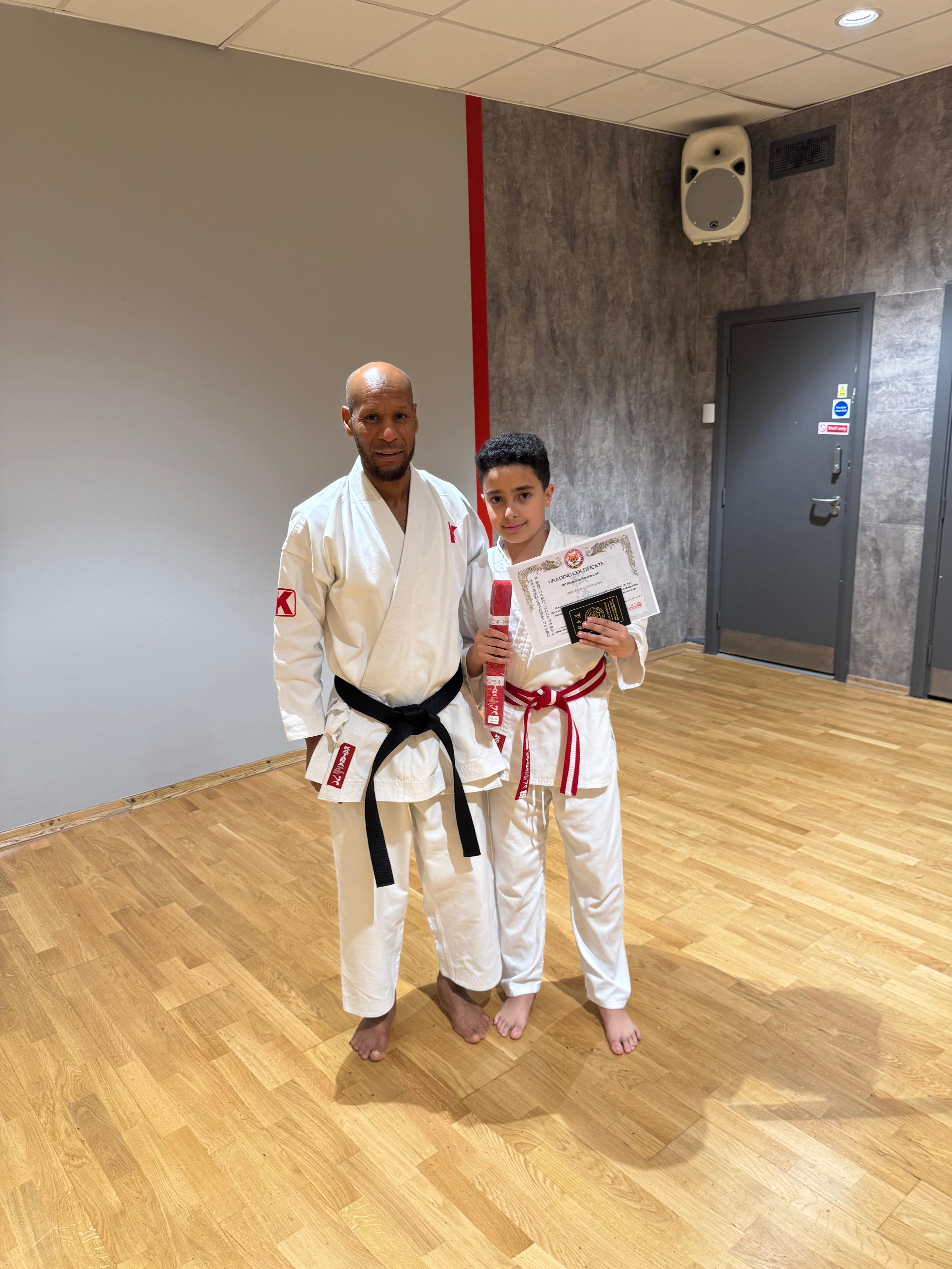 AN Shotokan Karate grading day ceremony with students receiving belts