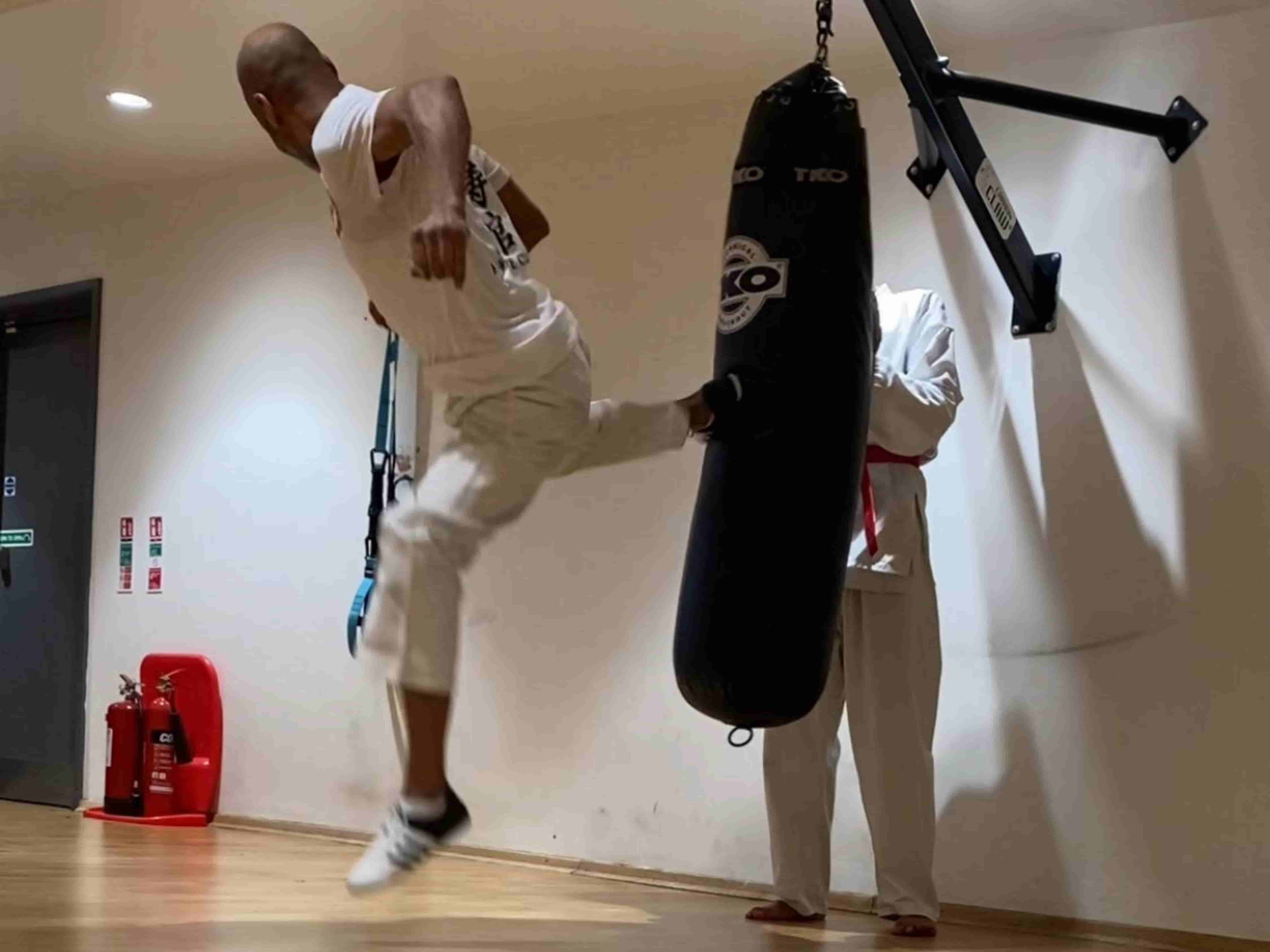 Students practicing Shotokan karate blocks in London dojo